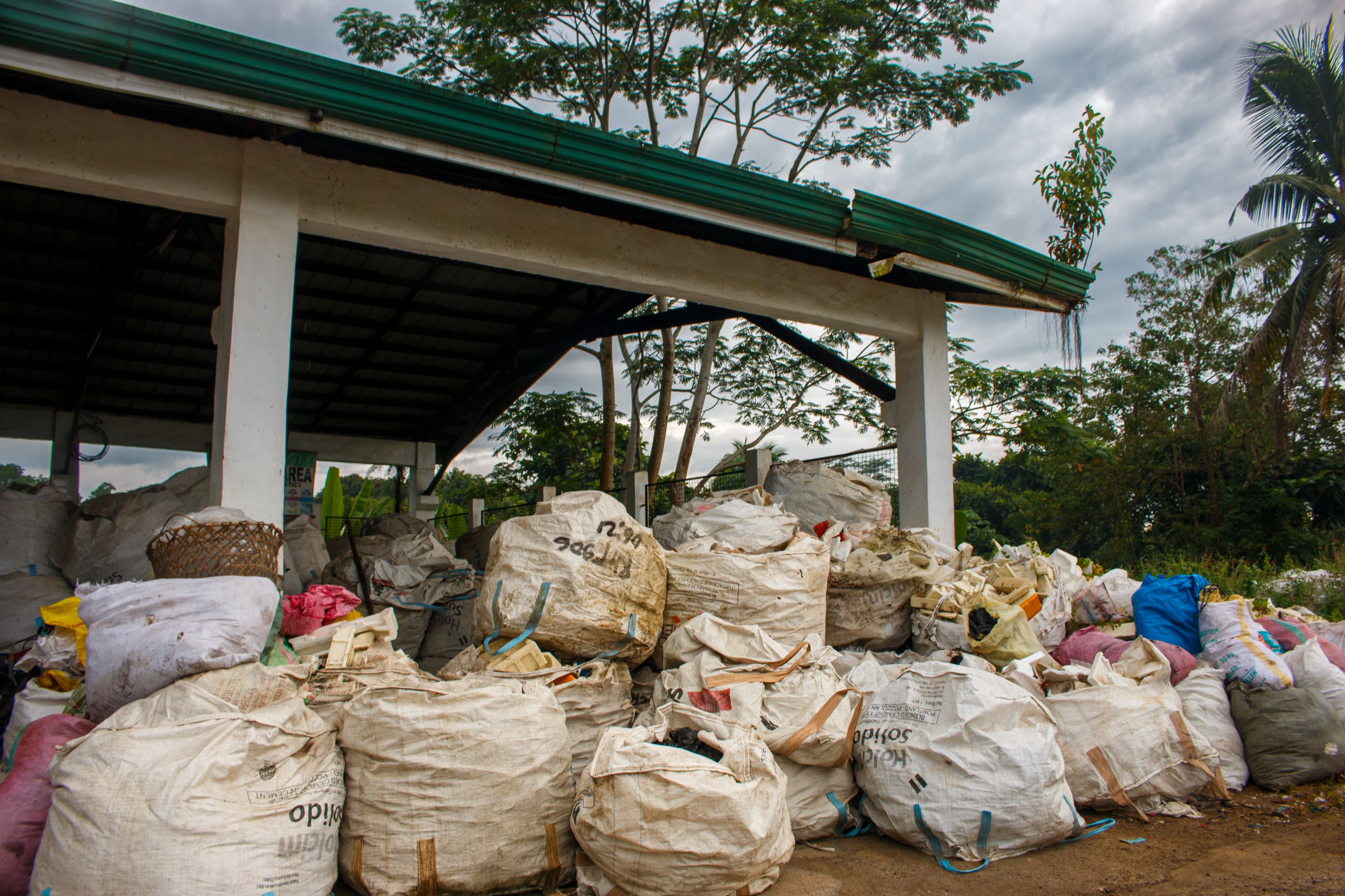 Sorted plastics are placed into sacks.