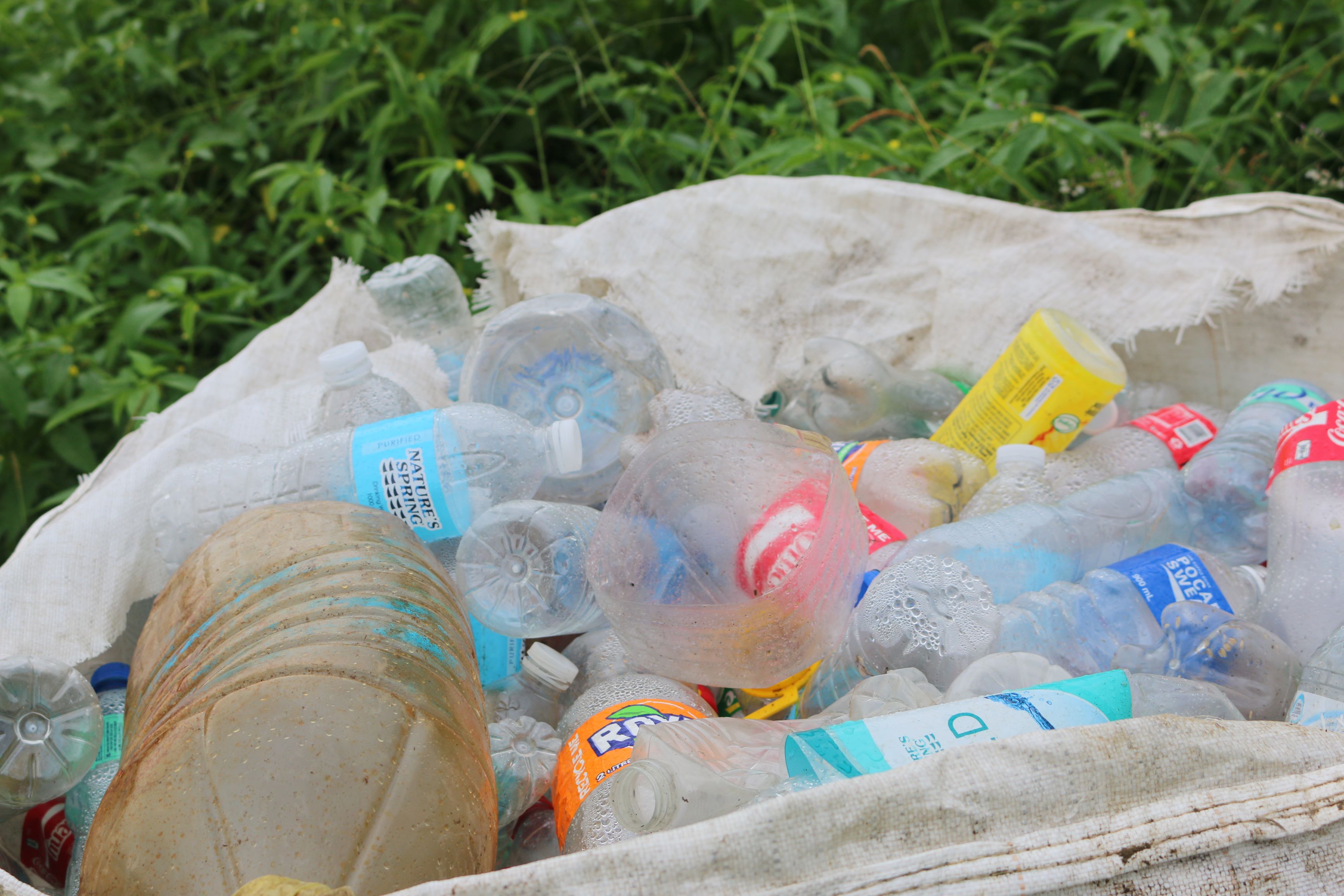 Sorted plastics are placed into sacks.