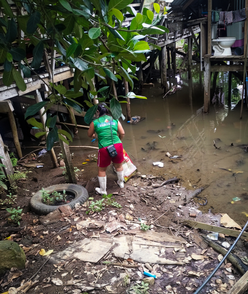 Houses stand on wooden stilts above muddied waters in Barangay Mabua, situated near the river. Photo courtesy of MARITES-Mabua