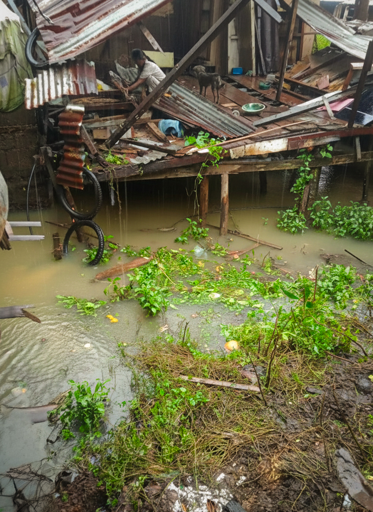 Houses stand on wooden stilts above muddied waters in Barangay Mabua, situated near the river. Photo courtesy of MARITES-Mabua