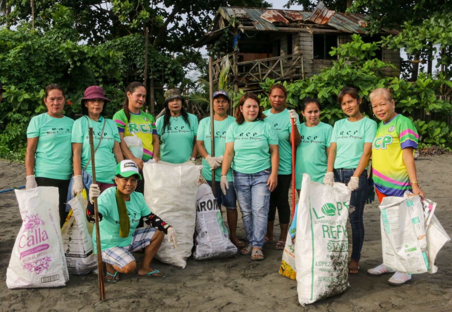 Holding waste pickers and garbage bags in tow, MARITES members join the coastal cleanup activities in celebration of World Ocean Day along the coast of Tandag.